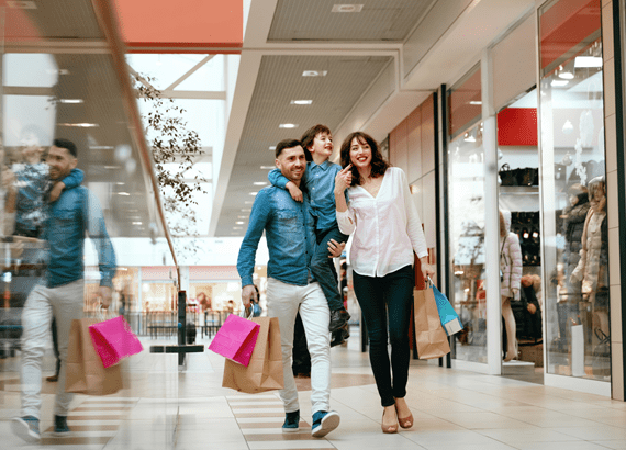 iStock-956571254_Family Shopping. Happy People In Mall.jpg