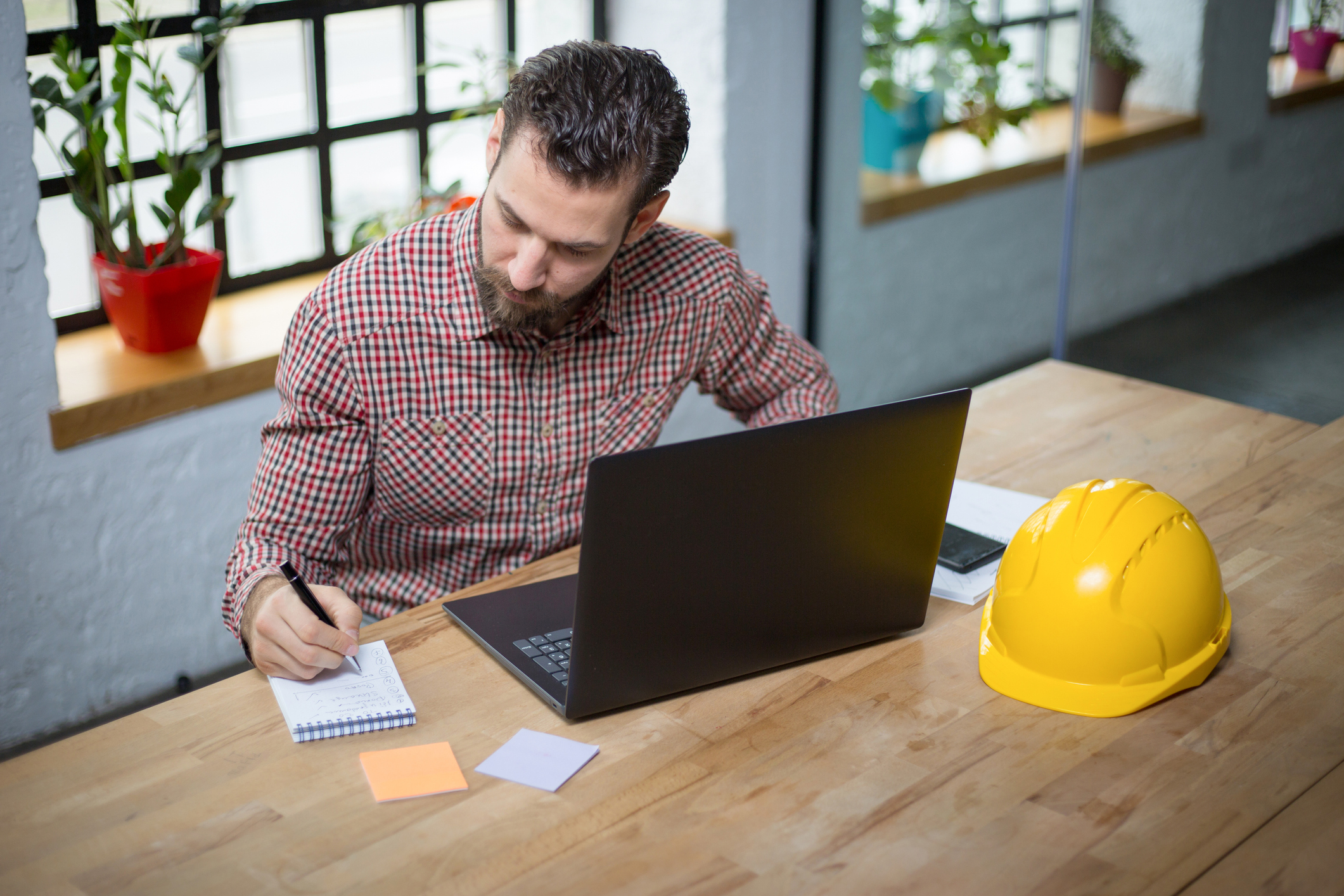 iStock-1203015834_Young architect working on new ideas at his office.jpg